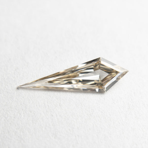 0.58ct 13.83x4.36x1.91mm VS+ Champagne Kite Step Cut 18518-01 - Misfit Diamonds
